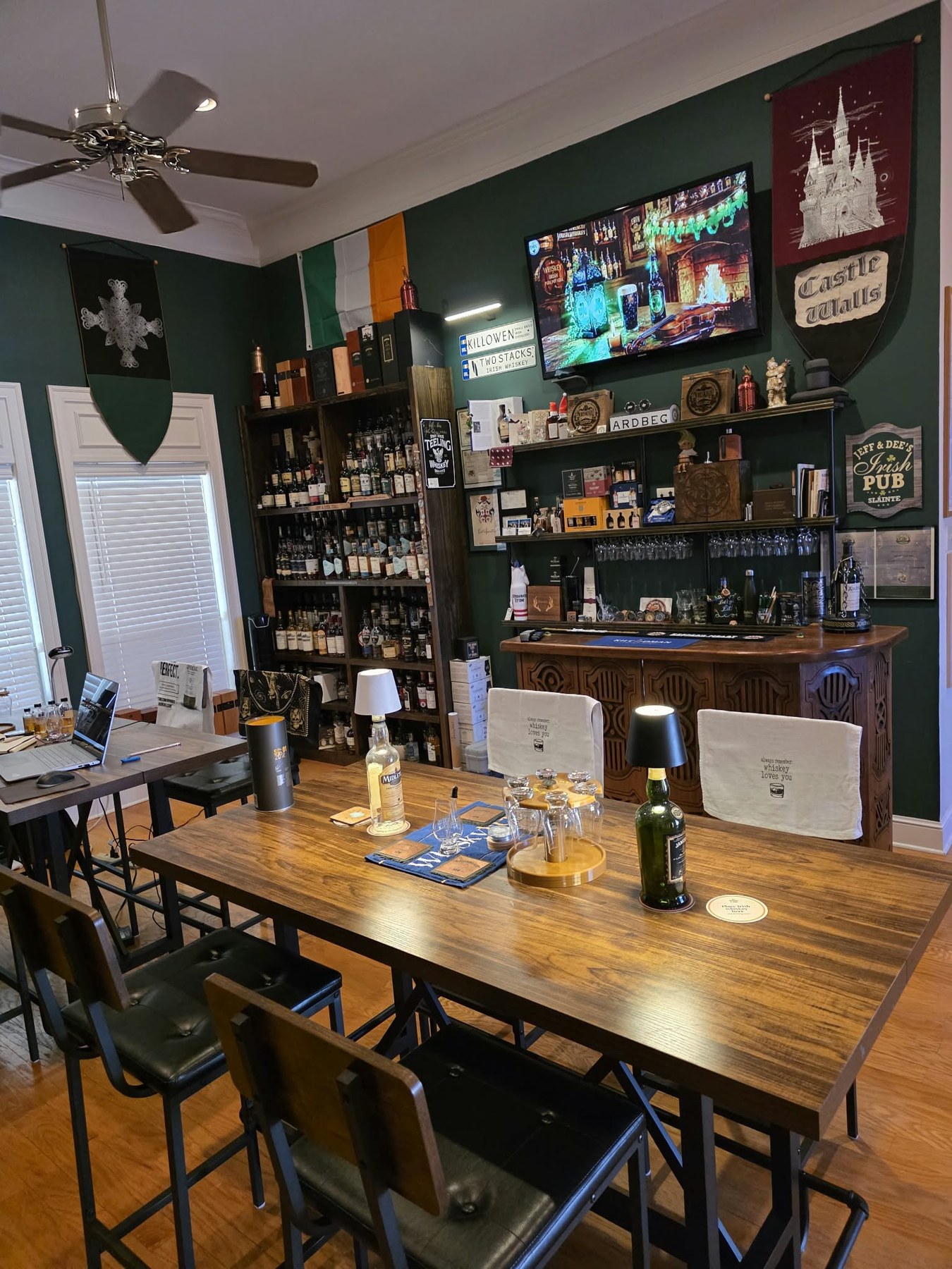 Mid South Drams whiskey room with a tasting table and bottle collection